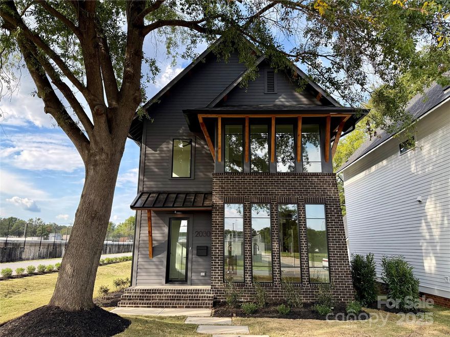 Welcome to 2030 Washington Avenue in Charlotte's Historic McCrorey Heights Neighborhood. Developed by MBH Construction, a local Builder known for unique, custom homes built with exceptionally high quality, precision and care. This modern home features an open plan with spacious, natural light-filled rooms, tall ceilings and premium finishes. Fresh and stylish finishes include site-finished matte hardwood floors, designer tile/lighting/plumbing fixtures, custom kitchen/baths, and much more. Outside, this home has curb appeal galore with numerous architectural details including brick feature wall and foundation, cedar accents, exposed soffits/rafter tails/brackets, and Pella® Windows. Just outside of Uptown Charlotte and convenient location to major highways and CLT airport. 2-10 Home Warranty included.