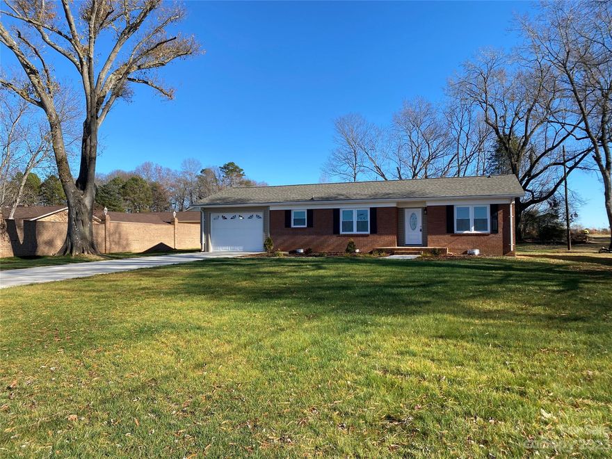 West Iredell Location! Move in ready Brick Ranch has been newly renovated and sits on a little over a half acre lot.
New Roof, New Kitchen and Bathrooms. Nice new large deck and back yard for outside entertaining. Workshop sits behind home with power. No HOA and a country setting.
