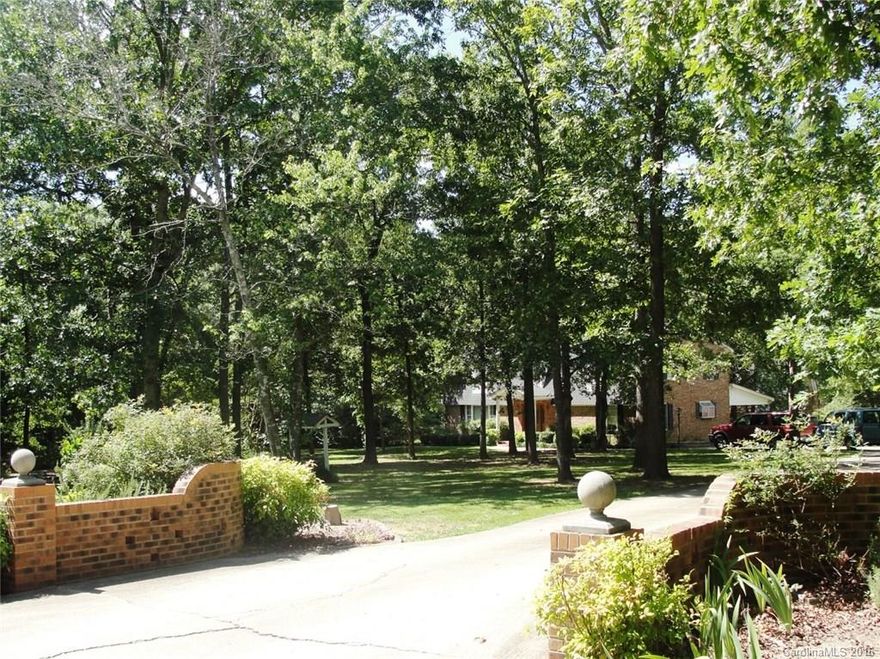 A most unique home featuring 2 story main house w/4 bedrooms and 2.5 ba.  Large bonus rm up w/neat built-ins. All new carpet thru out hm. Huge covered porch on back. Beautifully landscaped.  2nd hm is perfect guest home or Mother in law suite. Oversized garage shop w/added storage rooms. Lean to off garage. Fenced yard with added fenced dog run. New roof 2009. Beautiful piece of land on lovely street.  MUST SEE this one!