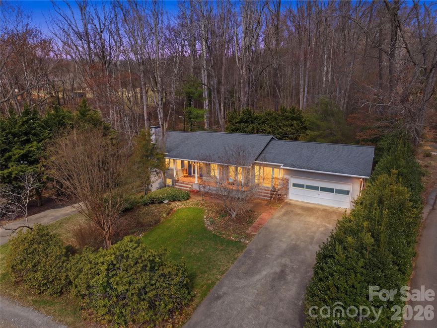 House Hack Opportunity near Lake Junaluska! Live upstairs and offset your mortgage with the lower level. This beautifully updated 5BD/3BA brick home (3,274+ sq ft) offers a versatile layout with an upper 3BD/2BA main residence and a separate lower 2BD/1BA living space—complete with its own driveway and meter, ideal for multi-generational living, guests, or rental income.

The main level features warm wood floors, abundant natural light, a cozy wood-burning fireplace, and a beautifully updated kitchen with granite countertops, stainless steel appliances, custom soft-close cabinetry, and a charming breakfast nook.

Downstairs, the fully finished second living quarters provides flexibility for extended family, long-term tenants, or a private guest suite, making this property as functional as it is attractive.

Enjoy outdoor living from the inviting rocking-chair front porch or the private back patio surrounded by lush landscaping, all complemented by plantation shutters and an oversized two-car garage.

Just a short walk from Lake Junaluska and only about 25 minutes to Asheville, this move-in ready home is a rare opportunity to own a property that blends lifestyle, flexibility, and income potential.