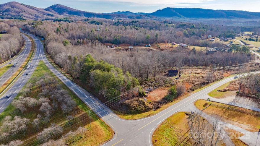 Discover an exceptional commercial opportunity with this 1.5 acre unrestricted property located on Ashworth Road, positioned directly at the I-40 exit 83 eastbound on ramp. This strategic corner location offers outstanding visibility and accessibility for a wide range of business or investment uses. The front parcel features 1 acre with over 200 feet of road frontage, providing an ideal layout for future development. The adjoining 0.5 acre lot adds flexibility for expansion or additional structures. The land is mostly wooded, offering the option to develop according to your vision. Whether you’re looking to establish a business, hold for future commercial appreciation, or build a high-visibility facility, this property delivers unmatched exposure and potential. Be sure to explore the 360° aerial tour in the listing, which showcases surrounding roadways, property lines, and the convenience of this high traffic location.