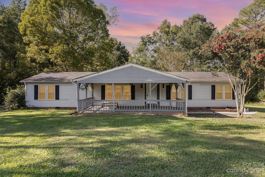 Discover your dream home on this sprawling 1.59-acre property! Enjoy the serenity of a private backyard that provides the perfect backdrop for your outdoor oasis. Step inside to find a refreshed interior boasting newly painted kitchen cabinets, complemented by new laminate and carpet flooring throughout the house (excluding the two bathrooms and laundry room).

Stay cool year-round with the brand-new 4.5-ton air conditioner and rest easy knowing that a partial roof replacement has been done. The kitchen has been enhanced with stylish new countertops, making meal prep a delight. The spacious laundry room adds convenience to your daily routine.

This home offers a well-thought-out layout with a split bedroom plan for added privacy. Plus, the 2-car garage provides ample storage space. Don't miss the opportunity to relax and entertain on the huge 15 x 25 covered front porch, where you can savor the beauty of your new home.