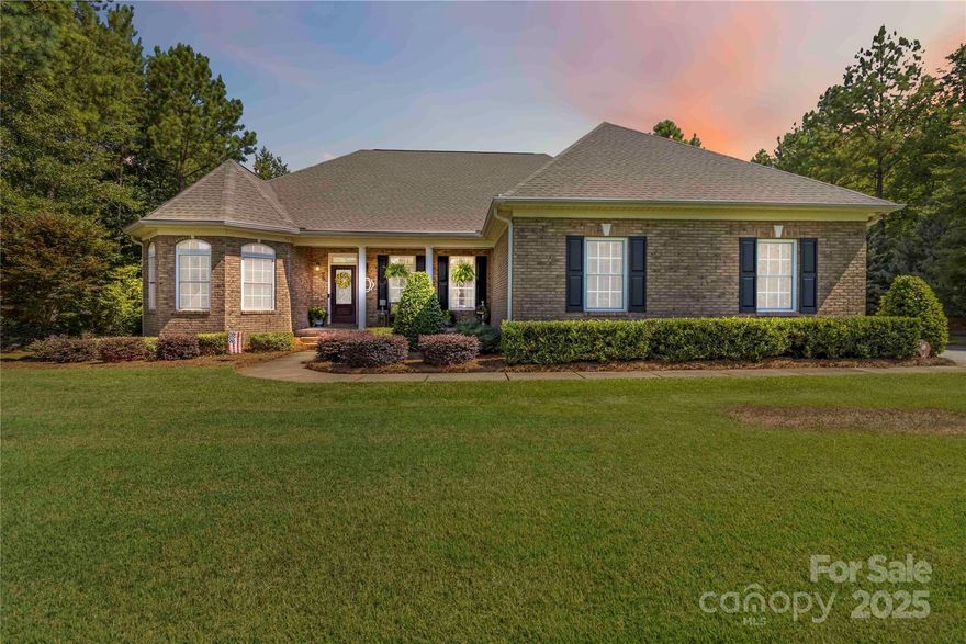 Beautiful four-bedroom, three and a half bath ranch with over 3,300 sq ft, featuring high ceilings, hardwood floors, and open living/kitchen space with a gas fireplace. The kitchen boasts a large island, a gas cooktop, double ovens, and ample storage. Spacious primary suite with double tray ceiling, updated bath, soaking tub, and separate shower. Two guest rooms on the main floor with new carpet. Upstairs bonus/4th bedroom includes a walk-in closet and full bath. Enjoy covered front and rear porches, in-ground pool with pergola, 2-car attached garage plus 1-car detached garage, all on a lush Bermuda lawn-perfect for entertaining and everyday living. The home also boasts a new roof & HVAC in 2023 and a new water heater in 2022