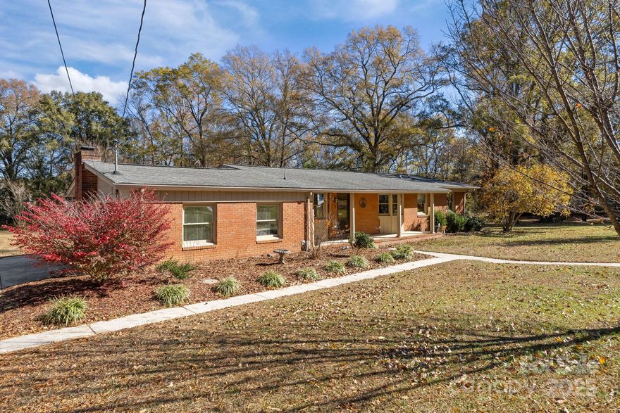 Have you been looking for a place to call home in the Charlotte area with room to spread out? A home large enough for a family and yet close to everything? Here is a rare and unique opportunity for you on nearly 2 acres just minutes from Charlotte Motor Speedway, PNC Music Pavilion, Concord Mills shopping, with NO HOA and just a short drive to the vibrant uptown!  Fully fenced back yard for pets and kids to play, all while having plenty more room beyond the fence line for all your needs. This three-bedroom, two full bath home offers two large family rooms great for working from home, for kids to play, or even an extra bedroom. The home features many upgrades, including an updated bathroom and kitchen. Outside, you will find three large buildings for storage and working as well as a wide concrete driveway for multiple vehicles. Come enjoy all that Harrisburg has to offer from the safety and comfort of this expansive lot in a quiet, established neighborhood.