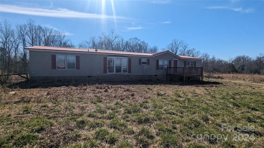 Large tract of land just east of downtown Kershaw. This +/-45 Acre lot borders Lynches River. Records show the property as 53 acres but seller has surveyed and subdivision plat will be recorded at closing to parcel off +/-7.3 acres as shown in photos. The property has been previously cleared but brush has began to grow back up across the lot. The area cleared around the double wide home has been more maintained than the remainder of the property. This home is ready for a new owner to make it their own. With some sweat equity, this property provides the opportunity to create a private and peaceful homestead. The seller has spoken with Kershaw county and the current zoning does allow for RV Park Development. Selling as-is. West side of property along Lynches River is considered a flood zone. Owner Financing available for qualified buyers.