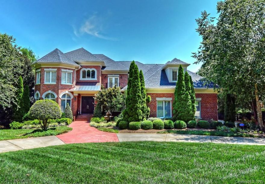 Stunning custom home w/ a sleek designer interior! Truly a masterpiece of design blending transitional & contemporary components into a one-of-a kind Ballantyne home! Perfect floor plan for entertaining w/a large gathering kitchen open to the greatroom.Lower level theater & billiards area w/auto remote blackout shades & awesome wine cellar.The seller recently upgraded the Audio Video systems in the house w/ $60,000 in new components!Outdoor kitchen, gorgeous pool & sweeping course & water views!