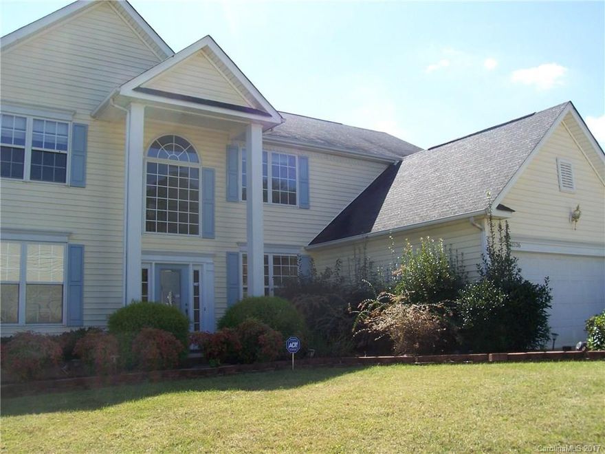 Huge Master Suite On Main Level with three bedrooms and bonus upstairs. This was the Builder Model Home. Garage which was used as an office remains enclosed is both heated and cooled . Thus, Garage Area Could Be Used As Office Or Recreation Area. Hardwoods in Entry, Den, Breakfast Room & Kitchen. Gas-Log Fireplace in Den.  Stainless Steel Appliances . Large Master Bath w/ Jacuzzi,  Separate Shower & Dual Sink Vanity. Detailed Molding In Formal Areas. Additional parking available. Freshly painted