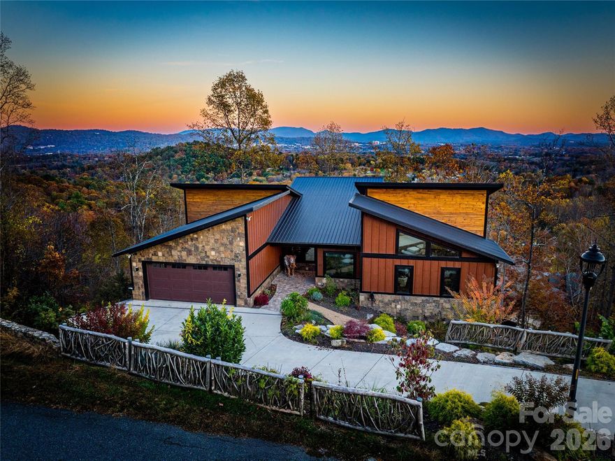 Enjoy the ever changing, breathtaking views as the four mild seasons explode with color and inspiration from every window and deck of this magnificent residence. Experience refined mountain living where privacy, craftsmanship, and thoughtful design come together in one of Asheville's most peaceful settings. Tucked away just beyond the gate on a quiet street this home offers a rare combination of seclusion and easy access to downtown. Built with emphasis on quality materials, efficiency and lasting construction the home showcases upscale finishes and a well considered layout with elevator access to all three levels that feels both elegant and comfortable. Natural light flows through the living spaces highlighting the attention to detail and creating a seamless connection to the surrounding landscape. Each space is designed to feel intentional, functional and inviting. The setting is equally impressive, lush, private and tranquil providing a true sense of retreat. Whether enjoying a quiet morning surrounded by nature or entertaining guests in a relaxed, elevated atmosphere, this property offers flexibility for full time living, a refined second home or a high end investment. Priced below appraised value for investment peace of mind and waiting to welcome you home.