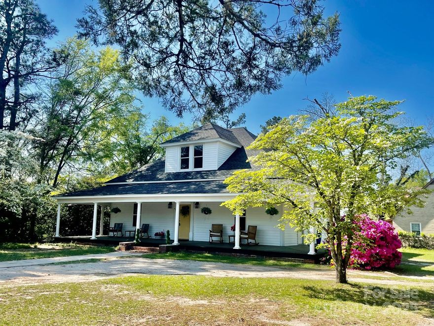 Fully remodeled historic home in the charming town of Kershaw, set on a lovely corner lot. This 4-bedroom, 2.5-bath home features a spacious kitchen with ample cabinetry, a main-level primary suite with a soaker tub and double vanity, and two cozy upstairs bedrooms with shiplap walls. Wide hallways, large rooms, and elegant French doors add character. Relax on the beautiful wraparound Southern-style porch. HVAC and roof are just 5 years old. Appliances to convey.