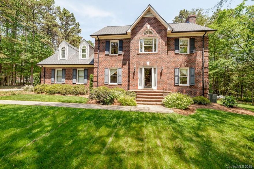 Impressive Stately Full Brick Home on 1.5-acre lot! 4 Bedrooms/Large Bonus room incl. guest bedroom/office on main level.  Fantastic open kitchen with granite counters, stainless steel appliances, center island, and breakfast area.  Formal Dining Room.  Sweeping archways into great room with gas fireplace.  Extra large wood deck with view of private wooded property.  Master Suite has lovely garden tub and separate oversized walk-in shower, plus double vanity.  Shows beautifully - don't miss it!