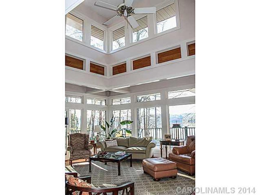 1.55 acre LAKEFRONT PENINSULA LOT-Unsurpassed level lot w/400' frontage on Lake Wylie, deep water, beach area & boat dock w/lift. This custom-built home by architect & author Sarah Susanka was designed to maximize the panoramic lake views. Open floor plan w/2 bedrooms on the main level, sunroom, wrap around deck & stunning gardens/landscaping compliment this truly exceptional offering.