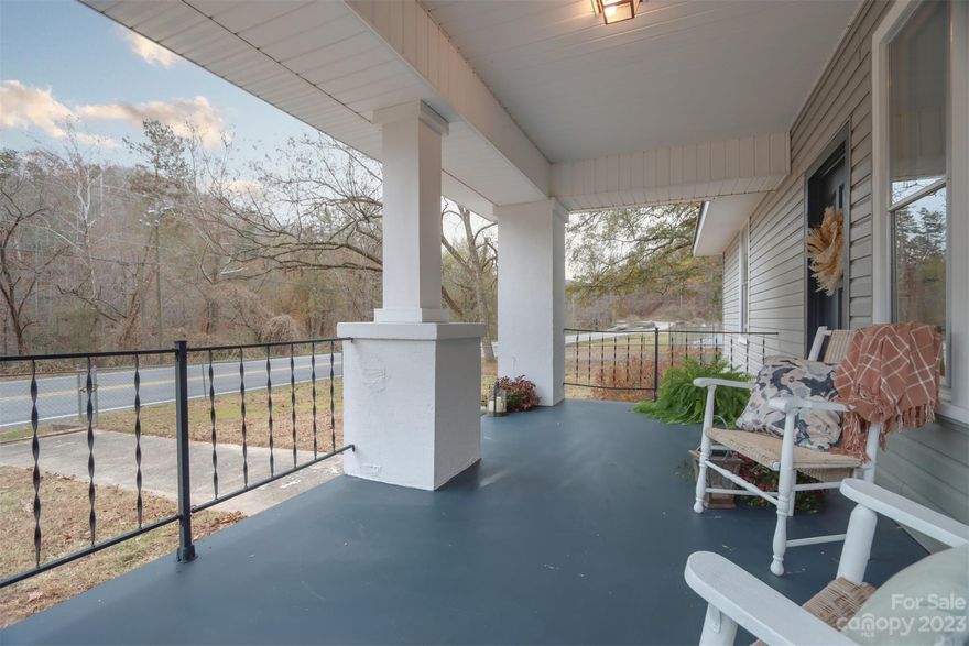 THIS IS A GREAT OPPORTUNITY TO OWN RIVERFRONT ACREAGE WITH A BEAUTIFULLY RENOVATED HOME OFF HIGHWAY 9! This charming 3BR 2BA home in Mill Spring is ideal for a full time residence or rental property! Professionally painted on the interior & exterior, this home boasts newly installed Italian tile kitchen countertops & backsplash, bathroom vanities, french doors, LVP flooring & bohemian light fixtures throughout! Enjoy having a cup of coffee or your favorite evening beverage on your covered front porch area. The riverfront property just across the street is the perfect setting to entertain and relax by the river. Wanting to build additional structures on the property? This is a great option as zoning ordinances do not apply to this location. Only minutes from Lake Lure, Columbus & Tryon Equestrian Center.