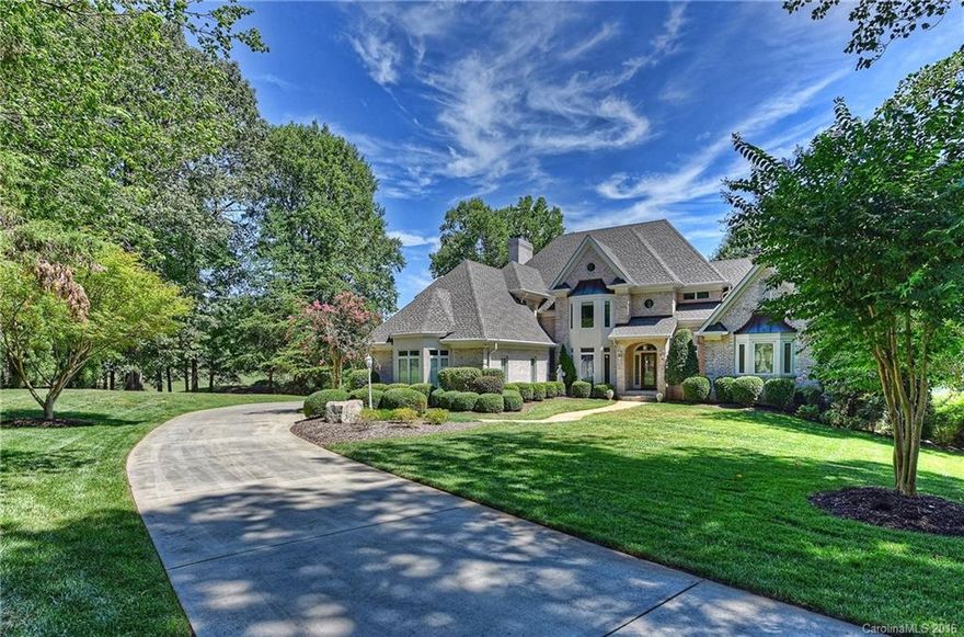 Back on market! Buyers unable to sell their home. Absolutely gorgeous views from every window--prestigious Peninsula Country Club Hole #18 on one side, Fairway #6 on another and beautiful Lake Norman on another. Enjoy many hours on your wrap-around covered back porch or your wide Lake Norman cove and private covered dock. This very fine custom estate has been meticulously maintained. New ORB fixtures. Just a few more touches and it's done! HOA-approved for a pool and room to add a garage.