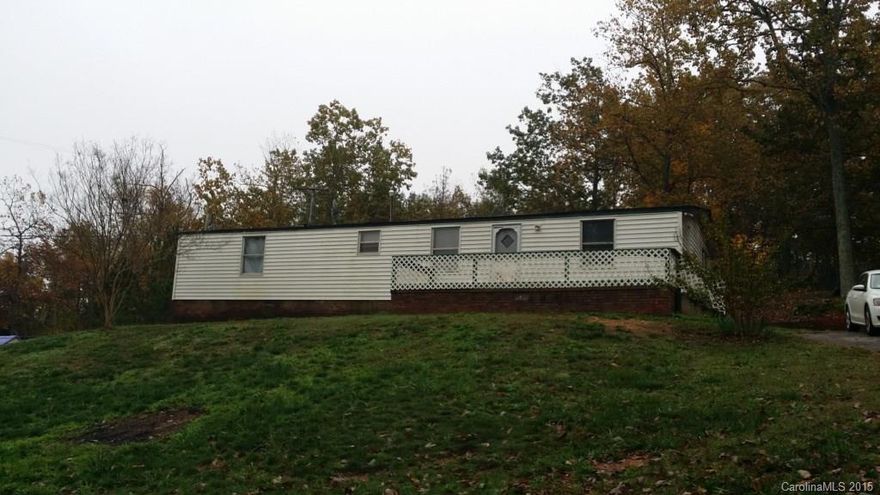 How does sitting on your front deck watching the world go by sound? This home sits on a nice treed lot waiting for you to enjoy some private time. Split bedroom floor plan. The home does need work & is being SOLD AS IS! No repairs will be made. Bring your imagination!