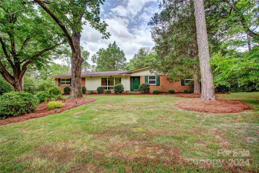 Don't miss this all-brick, four-bedroom, three-full-bath home situated on a quiet street, conveniently close to all the amenities Concord offers. The dining room features a mirrored wall, while the living room is adorned with built-in shelving. The family room boasts a stone gas fireplace, complemented by built-in cabinets and shelves. Enjoy entertaining on the large patio situated just off the family room. Large windows let in the light lending to many uses for the large rooms.The property has seen several recent updates: Gutters: 2022, Water lines to the street and under the home: 2023, HVAC system: 2017, Hot water heater: 2023 Stainless refrigerator: 2023. This combination of charm and modern updates makes it an attractive option for potential buyers. Supra located on side door.