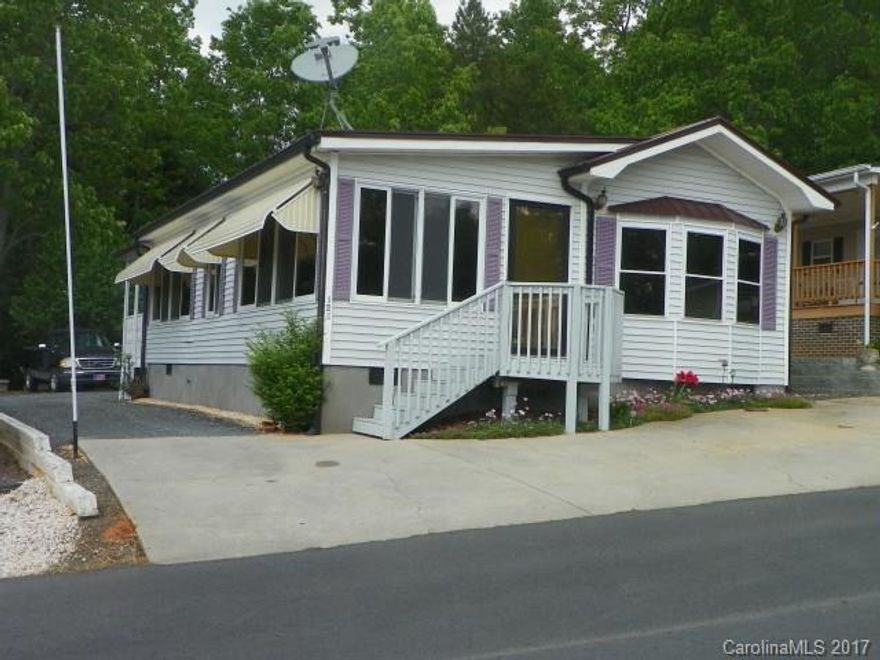 Nice Modular with lake view, covered back porch with ceiling fan and shades, private. Awnings over most windows, Metal roof put on 2016, New  Granite counter tops in Kitchen.
new floor covering in LR/Kit/DR, BR, New (2015) kitchen appliances, (SS), self closing cabinets, solid surface stove. New Hot water heater (2015), HP/CA replaced 2013).Interior painted 2015, Wired 10x10 storage bldg. Bath room- new shower, toilet,  flooring, vanity, and medicine cab. Lake View from front and back of home.