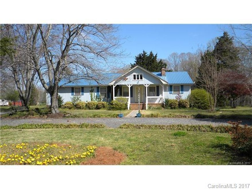 Wonderful country living with a rocking chair front porch, sunroom, deck, open & airy greatroom with woodburning fireplace, space aged insulation in attic for efficiency, large master bathroom has no vanity but has a space and is plumbed for one, hardwood floors in living area, pet doors, fenced in back yard, gazebo/deck, workshop/barn with power, sensor lights, small greenhouse and superb mature landscaping.   ZONED BD-III  NOTICE: