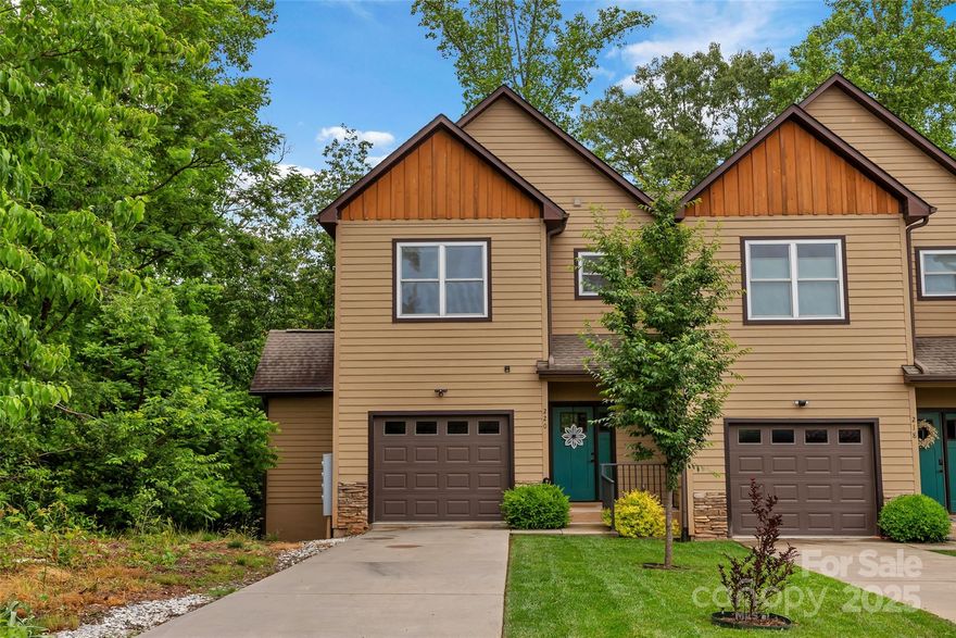 Welcome to your end unit townhouse in Black Mountain right on the Rainbow Trail to Montreat! No rental restrictions! This breathtaking space boasts beautiful oak hardwood floors and soaring 9’ ceilings, creating a bright and welcoming atmosphere. Chef's kitchen featuring generous 42” upper cabinets, soft-close drawers and doors, exquisite granite countertops, and modern stainless steel appliances. Private deck right off the living room—perfect for relaxing evenings or morning coffee. This unique unit has two master suites, each with spacious walk-in closets and en-suite bathrooms, ensuring your utmost privacy and comfort. One suite is oversized with room for sitting area or bunks. Could be spilt into 2nd and 3rd bedrooms with the straight forward addition of a wall.  Both rooms have expansive seasonal mountain views.  You'll love the convenience of a single-car garage with ample storage space & walk-in height crawl space under unit. 1.3 miles to the center of Black Mountain & Montreat.