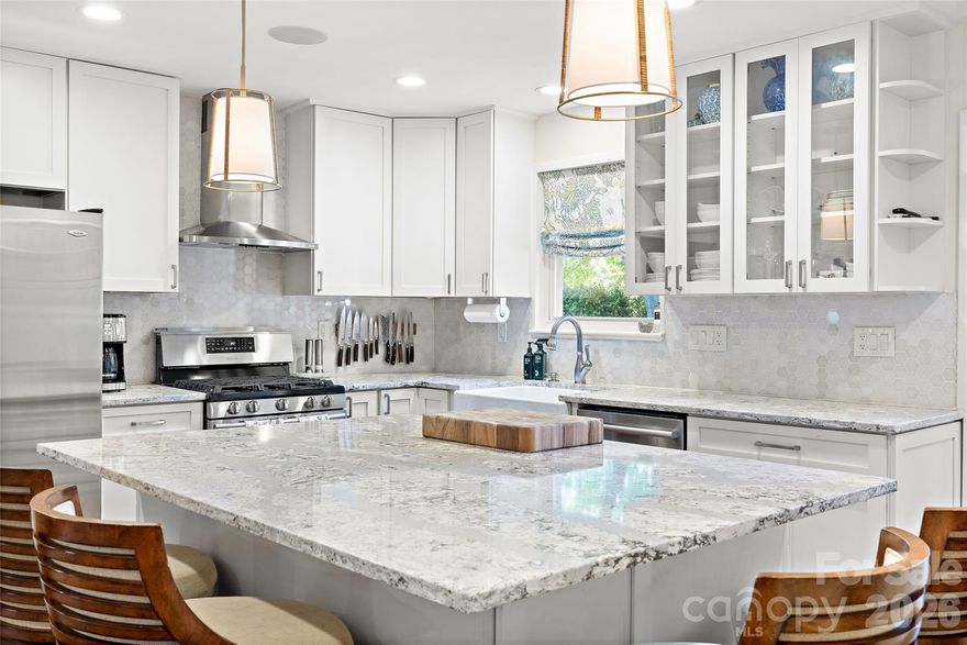 Madison Park charmer with stunning updates! Fabulous kitchen, lovely bathrooms, hardwood flooring, newer windows and amazing EZ-Breeze sunporch. Three bedrooms and THREE full baths plus a brand new powder room on the main convenient for guests and every day living. Kitchen features quartz countertops, white shaker cabinets, stainless appliances and a great view of the spacious and flat backyard. Sunporch not included in SF but provides great extra living space for most of the year. Spacious primary with walk in custom closet and stunning bathroom. Additional bedroom with wainscoting, and equally lovely secondary bath on upper floor. Lower level features large laundry room with built-in storage cabinetry, an office/den and bedroom plus full bathroom. Fully fenced backyard is beautiful with its paver patio, trex deck and storage shed. Close to all the amenities of Park Rd Shopping Center, South End and uptown, plus very convenient to the miles of the Sugar Creek Greenway. Don't miss this special gem!
