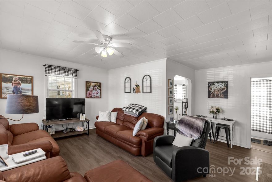 Welcome to this delightfully sweet two bedroom, one bath home nestled in a well-established neighborhood. This inviting property boasts an abundance of natural light through newer windows, creating a warm and airy atmosphere throughout. Thoughtful updates blend modern comfort with timeless charm, including new fixtures, paint, stylish vinyl plank flooring, updated cabinetry, and a beautiful tile backsplash. Enjoy year-round comfort with central heat and air conditioning. Outside, you’ll find a convenient one-car carport and a separate storage building—perfect for extra belongings or a workshop. Whether you’re relaxing indoors or entertaining friends, this home offers the perfect blend of cozy living and contemporary style. Conveniently located near local amenities, schools, and parks—this gem is move-in ready and waiting for you! Don’t miss your chance to own this charming home—schedule a tour today!