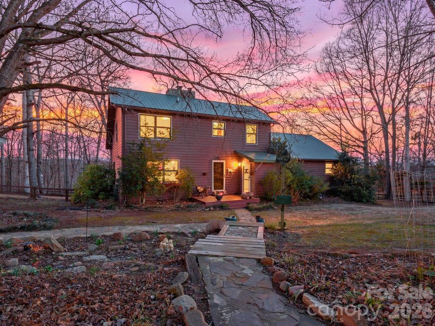 The horse farm you've been waiting for! Grove Hill Farm on 6 plus acres of fenced pasture in a very desirable area of Campobello. 3 bedroom/ 2and a half bath home is filled with character and charm. From the overhead beams to the stone fireplace and the wide plank hardwood floors to the extensive built-in bookshelves, the home is warm and inviting. Large 40 ft deck spans the back of the house perfect for enjoying privacy and views while nature surrounds you. In Spring, the property comes alive with flowering trees and bushes. Recent updates to kitchen and bathrooms include quartz counters, new vanities and interior paint. The 3 stall barn with tack/feed room and large storage bay provides direct access to turnout for easy horse care. The 3 fenced pastures allow for rotational grazing. There is also a large fenced backyard with access from the house for your dogs. The unfinished basement with interior and exterior access and a woodburning stove allows for additional storage, a workshop or possibly finishing to add living space. Set-up for a generator. Circular driveway and 2nd exit gate for easy in and out with a horse trailer. While this property is tucked away and peaceful, it is still convenient to stores, restaurants, and all the area has to offer. 15 mins to downtown Landrum; 22 minutes to Tryon International Equestrian Center; 8minutes to Highway 26. Don't wait. Horse farms in this price range in this desirable area are VERY RARE!