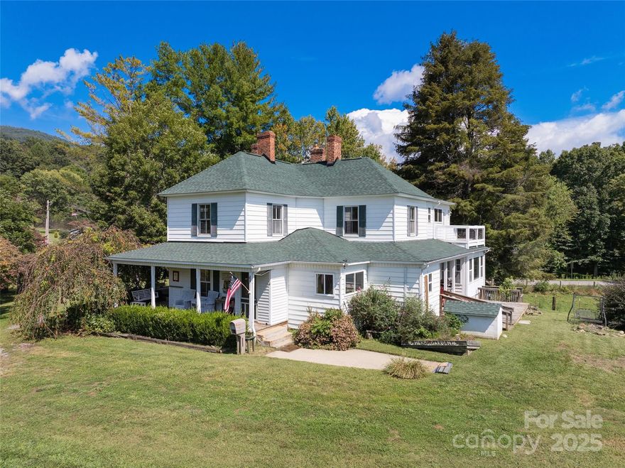 New 30 year architecture shingled roof!!! This stunning 1908 estate is a true gem, offering a perfect blend of historic charm and modern amenities. Set in a tranquil, pastoral setting with breathtaking mountain views, it presents an incredible opportunity for a private residence, Bed & Breakfast, or investment property which features Spacious 3,700+ sqft of meticulously restored space, ART STUDIO area, 4 Bedrooms,including 2 luxurious primary suites. 4.5 baths, bonus Rooms for versatile use, 700-square-foot garage/outbuilding for additional storage/workshop space.Historic Charm Meets Modern Comfort while the home has been beautifully remodeled to include modern amenities, it has retained its original craftsmanship and historic integrity, creating an inviting atmosphere full of character and warmth on unrestricted property located Just 10 minutes to Waynesville & 25 minutes to Asheville, you’ll enjoy the peace and seclusion of the countryside without sacrificing convenience to town amenities.