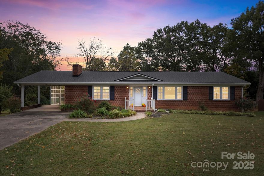 PRICE REDUCTION and newly refreshed painting updates have been added! Welcome to this charming 1960 Brick home near Cherryville Country Club! Great location and backs up to the Cherryville Country Club golf course. This 3-bedroom, 2-bath brick home offers classic details with modern efficiency. Step inside to find hardwood floors flowing throughout the main living areas and kitchen (no older linoleum here), with tile in both bathrooms. Hardwoods are also beneath the front den carpet too. The inviting living room features custom Canadian Cedar tongue-and-groove walls and a cozy wood-burning fireplace. The open layout connects the living, dining, and kitchen areas, creating a welcoming space for large family and friends gatherings. The kitchen offers ample cabinetry and great functionality. Two of the bedrooms feature double closets, while all enjoy plenty of natural light from the newly installed windows. The screened side porch and spacious front porch provide perfect spots for relaxing outdoors as well as the large back deck. The home also offers a full basement with interior access as well as a double-door exterior entry. With a second wood-burning fireplace, this space presents a wonderful opportunity to finish additional living areas or an activity cave if you prefer. The basement was home to the the owners workshop. Energy efficiency is built in, with foam insulation added to both the upstairs and basement walls, plus a roof replaced just 2 years ago. This classic brick home combines charm, comfort, and potential—all in a desirable location close to everything this small town jewel offers. Home sold AS-IS including both fireplaces.