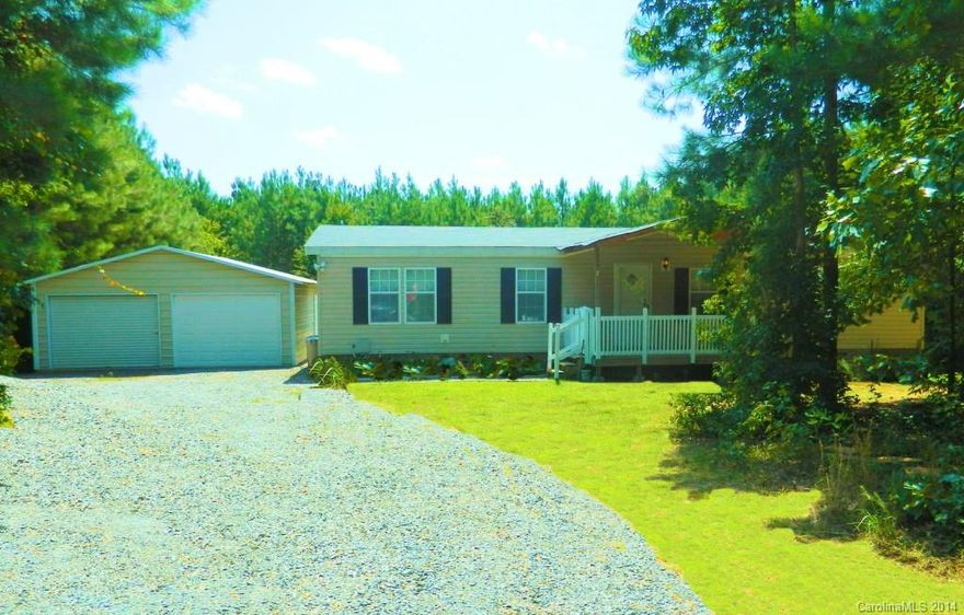 Quality living at a great price.  Privacy Plus; Surrounded by trees and over an acre of land!  Nice well kept home with many upgrades, a short walk to Badin Lake.  Split floor plan has large master with nice bath and walk-in closets in each bedroom.  Open living area; Living room (24'x 14') has vaulted ceilings.  Nice kitchen with Oak Cabinets, breakfast bar and side by side refrigerator included.  Double garage with workshop area.  Private back yard with woods all around.  Don't miss this one!