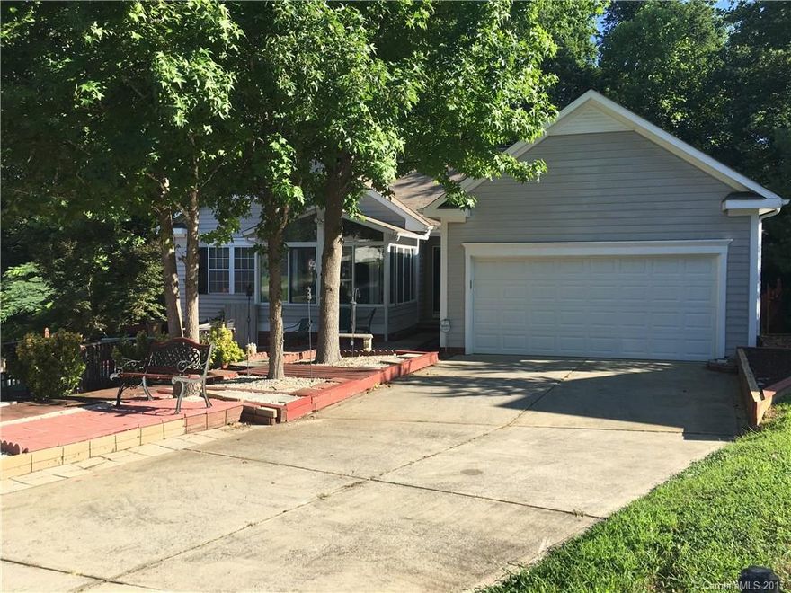 Comfy little home nestled in the trees and in a cul-de-sac!  Last buyer had to back out, but house is in good structural condition.  This home has some unique landscaping and has a great layout including a newer sun room that was added off one of the secondary bedrooms. Large kitchen open to dining and living areas.  Don't let this one go by!