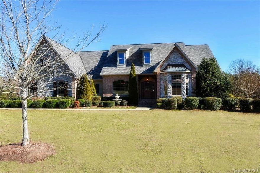 Beautiful 4 BR 3.5 BA ranch home on private 29 acre estate lot. Home features gourmet kitchen w/ center island, hardwood floors, great room gas log fireplace and elevated ceilings throughout. Split floor plan has master on one side and other BRs on the other. Many custom touches. Lots of outdoor living space. 3 car attached garage and detached 2400 sq ft out building. 2 carports for recreational vehicle parking. All this minutes from Lake Wylie, dining/shopping and a short drive to Uptown.