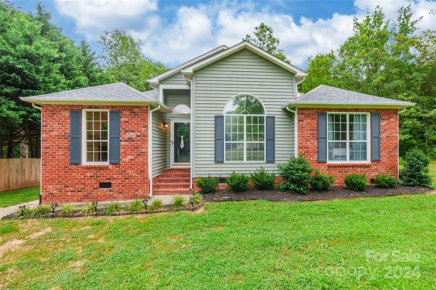 Discover the perfect blend of comfort & tranquility in this charming 3 bedroom, 2 bath home nestled on 1.29 acres. As you step inside, the home welcomes you with vinyl plank flooring that extends throughout, complementing the living room anchored by a cozy fireplace. The kitchen features granite countertops, a breakfast area bathed in natural light, and a convenient pantry. Retreat to the serene primary bedroom featuring tray ceilings and an ensuite bathroom complete with a dual vanity, garden tub, and separate shower. Outside, a deck overlooks the expansive backyard, offering a perfect spot for outdoor gatherings. No HOA fees add to the appeal of this desirable property. New roof and gutters installed in 2024. Recent upgrades include a new well pump and bladder, septic system maintenance including pumping and riser replacement within the past year. Washer and dryer included with an acceptable offer. Ramjack lifetime warranty.