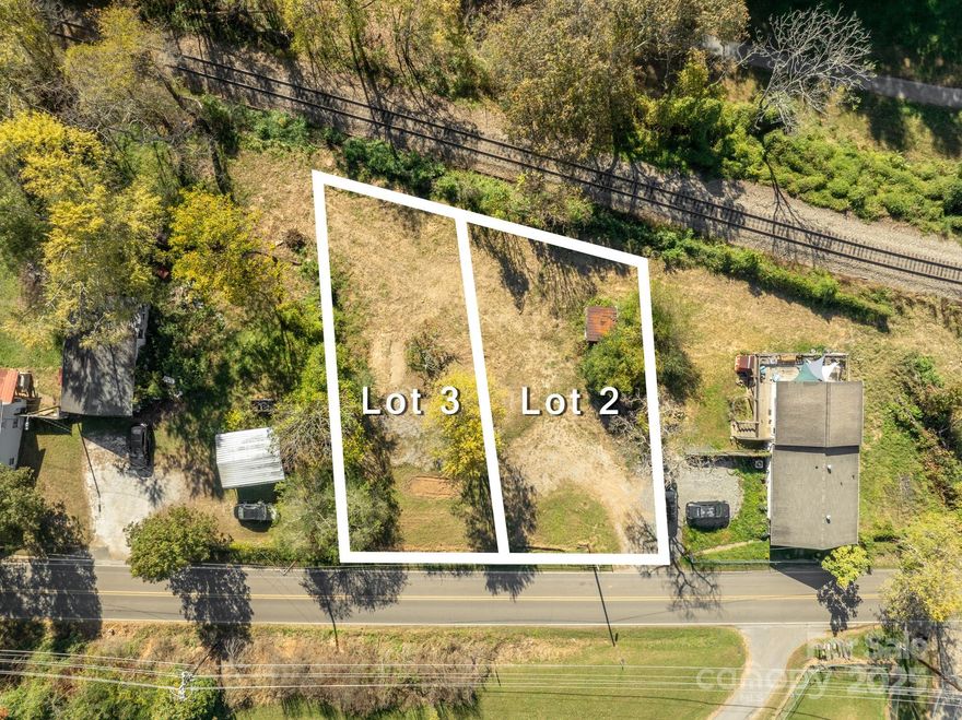 Gently sloping, easy build lot with city water, city sewer and natural gas– but outside of city limits with lower taxes and no STR restrictions. Join the other newly built homes along this corridor that easily connects the vibrant River Arts District, Historic West Asheville and bustling Downtown. Run, walk, skate, rollerblade, ride, and stroll along the French Broad River on the Wilma Dykeman Greenway. This dog friendly path connects with the French Broad River Greenway, and Hominy Creek Greenway, to provide approximately 6 miles of gorgeous greenway, passing multiple parks and river put-ins. In the RAD, galleries, shops, breweries and restaurants are reopening after the storm, and the community is committed to rebuilding. Join the movement and envision your perfect home- thoughtfully designed with efficiency in mind to add ease to your life. Be in control of every detail from the placement of the home on the lot and the placement of the interior walls to the materials and fixtures that bring your aesthetic to life. Call for more information and to schedule a showing for this unique opportunity to build a custom home with remarkable access while also saving money on utility infrastructure, annual taxes and foundation costs.