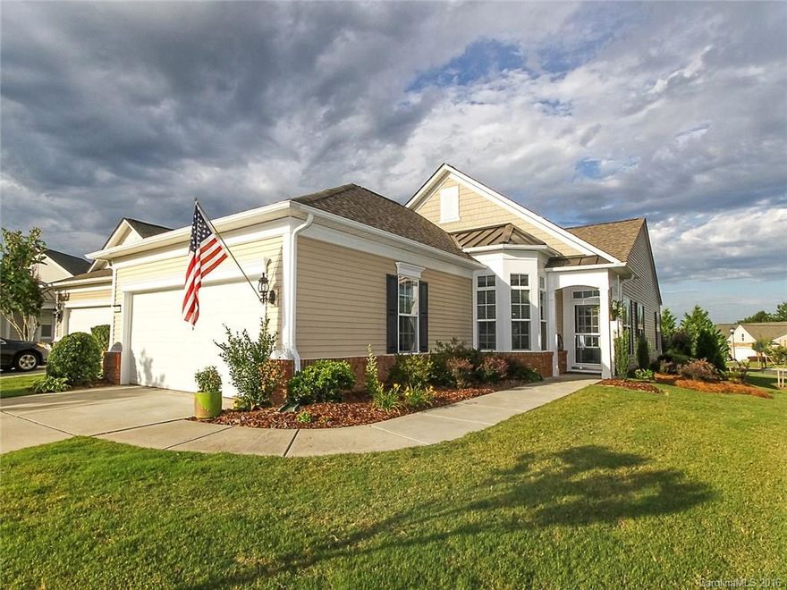 This lovely Gray Myst has a list of custom features and is truly unique. Superb location nearby amenities & Harris Teeter commercial area.  This 2BR/2BA home has laminate flooring throughout the house & ceramic tile. The exterior features an expanded patio with pavers and gorgeous landscaping including automatic awning with remote. Come check out the community and the active adult lifestyle of Sun City Carolina Lakes.