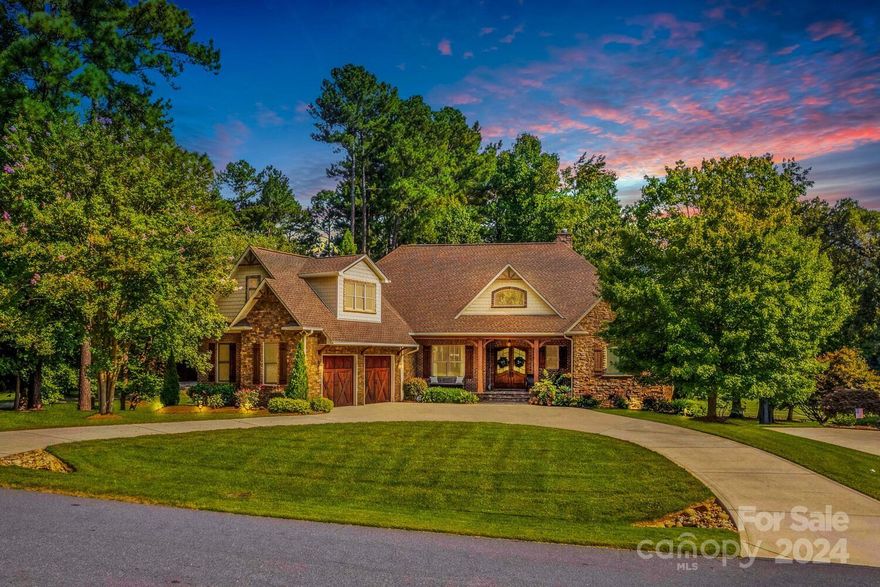 Welcome to a masterpiece of luxury nestled in Cowan's Ford Country Club at Lake Norman. Custom full-brick home with captivating golf course view. 5 spacious bedrooms, 4 designer baths, expansive workshop with half bath and mud sink. Main level exudes sophistication with gleaming hardwoods, gourmet kitchen, stunning great room and a luxurious master retreat. Central vac, security and intercom system, and 3 HVAC units for overall comfort. A newer roof adds to the home's long-term durability. Gorgeous stone accents, oversized two-car side load garage, circular driveway, manicured lawn and irrigation system. Finished lower level with kitchenette, great room and 2 bedrooms.  The outdoor living area is a true sanctuary featuring a gorgeous flagstone front porch, screened porch, open-air decks, covered patio, and wood-burning stone fireplace ideal for year-round gatherings. Memberships are optional to Cowan's Ford Golf Club that offers access to amenities, boat ramp & day dock. Welcome Home!