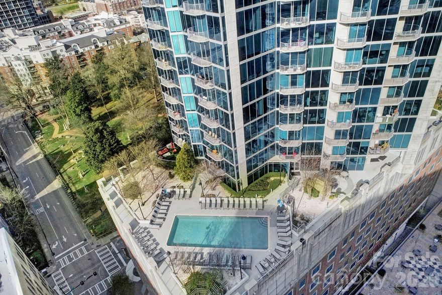 RARE AND SOUGHT AFTER RENTAL CERTIFICATE FOR INVESTORS IS AVAILABLE FOR THIS UNIT. Or make this your home. Ready for high-rise condo living in the heart of Uptown Charlotte?! This 1BD/1BA on 31st floor has spectacular, unobstructed views! It features hardwoods throughout kitchen, living room & hallway, and granite, tile back-splash and Stainless Steel appliances in kitchen. Spacious bedroom with huge window view, and granite w/tile shower in bath. The patio faces the sunset/mountain view for miles.  One reserved parking space in garage. Fabulous outdoor entertaining space includes a huge pool, gorgeous fireplace with built-in TV, courtyard & gas grill. Other amenities include 24-hr concierge, Amazon Package Hub, state-of-the-art fitness center and yoga room, theater room, Sky Club w/bar, billiards, pool table. Walk to local restaurants, theater, galleries, retail, sporting events, & nightlife! Unit freshly painted on 3/15/2026! NOTE ON SQUARE FOOTAGE: Unit has been professionally measured (737 SF). Other 1B/1B units may be using builder SF (791) which measures from exterior walls, not interior walls, so you'll note the delta.