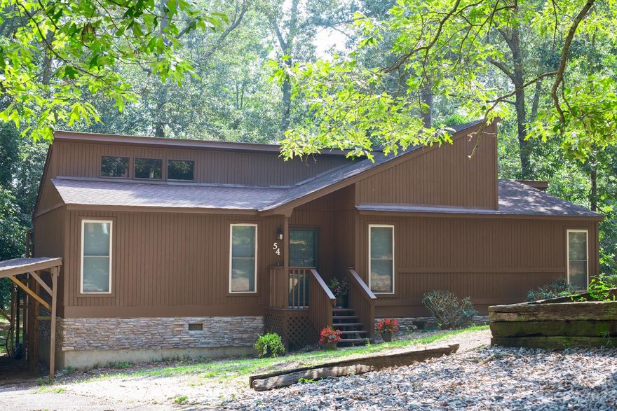 This beautifully maintained 3 bedroom, 2 bath home located on a large corner lot in the quite neighborhood, only minutes from stores and restaurants. Large deck, has space for outdoor living, room to play and taking in the sounds of nature. Updated bathrooms, new appliances, LVP flooring, HVAC, carport, and modern fans. There are many options as a second home, an investment, or downsize and retire in this peaceful, wooded setting.