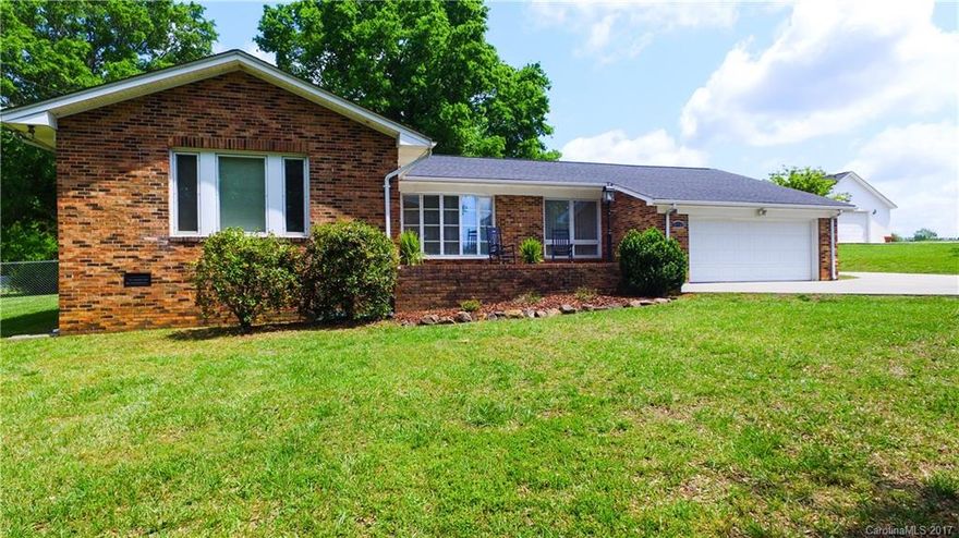 Country Living at its best! An adorable Ranch Style Home in Move-In Condition. Featuring 3 Spacious Bedrooms, 2 Full Baths, partial Hardwood Floors, Fireplace in Breakfast area, Stainless Steel Appliances, Granite Counter Top in Kitchen, extra large Laundry Room w/ Tiled Flooring, on 1.65 Acres, and a 3 Bay Garage Workshop already Wired. The Backyard is completely fenced in with a lovely concrete patio and a built-in Charcoal Grill. New Water Heater.