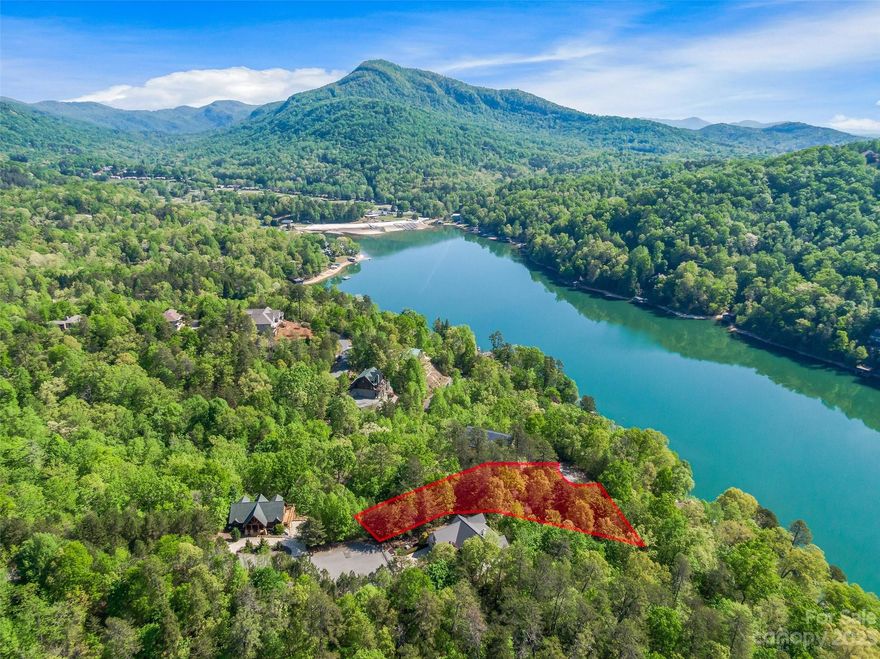 Here's your opportunity to build your lake view dream home in the picturesque community of Rumbling Bald! This  building lot boasts breathtaking lake & mountain views, providing the ideal backdrop. Nestled in the heart of the stunning Blue Ridge Mountains, Rumbling Bald on Lake Lure is a serene gated resort community that offers an idyllic lifestyle. With access to pristine Lake Lure, residents can enjoy a range of water activities including swimming, boating, fishing, & more. The half acres lot itself sits at the end of a cul-de-sac on the side of a hill overlooking the lake. In addition to its stunning natural surroundings, Rumbling Bald also offers a range of amenities for residents to enjoy including golf courses, outdoor/indoor pools, tennis courts, basketball courts, minigolf, fitness centers, a marina, community beach w/ lake swimming & onsite restaurants. Close to Chimney Rock Village and just a short drive to Asheville shopping and breweries. -See interactive map & 360 aerial