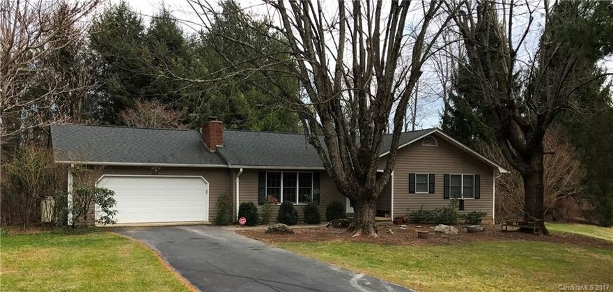 Peaceful setting for this 3BR/2BA ranch. Large 1.2 acre lot.  Recently updated home features wood & tile floors throughout. LR boasts gas log FP. Spacious kitchen with corian counters. Relax and enjoy the private back yard from your screened back porch. Deck area perfect for sunning or grilling. Partially fenced back yard. 2 car garage attached. Laundry on main. Alarm system.