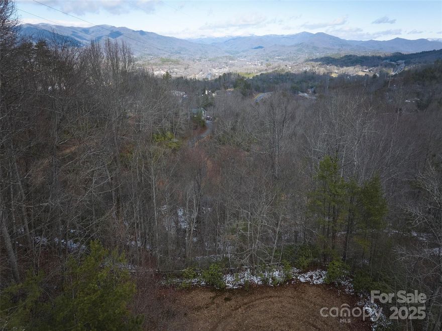 If you want to live way out in the woods, but need to be close to downtown Bryson, this is the spot. This lot is an excellent back-in-the-woods homesite, but close to Ingles. The flat lot is ready to build after permitting, clear trees for a view to north and east. It is also well north relative to the mountain, so it will get get sun in the winter and have expanded views. The back of this subdivision has not filled in, so this lot is like the middle of a private park for walking the dogs, etc. The property is also close to everything in Bryson City and Cherokee, Fontana. Vacation rentals allowed.