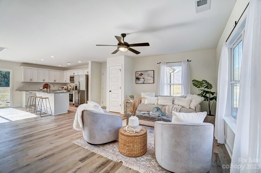 Welcome to your dream home in Locust, NC! This brand-new construction offers an unparalleled blend of modern luxury and comfortable living. With 3 spacious bedrooms and 2.5 bathrooms, including a primary suite on the main level, this home is designed to exceed your expectations. Step inside and be greeted by an abundance of natural light that fills the open-concept living spaces. The thoughtfully designed layout seamlessly connects the living room, dining area, and kitchen, creating an inviting atmosphere for both entertaining and everyday living. High ceilings and elegant finishes throughout add a touch of sophistication to the entire space. Indulge in culinary creativity in the well-appointed kitchen, complete with top-of-the-line appliances, sleek countertops, and ample storage for all your culinary essentials. The adjacent dining area and living room offers the perfect setting for family meals or gatherings with friends. Located in the heart of Locust!