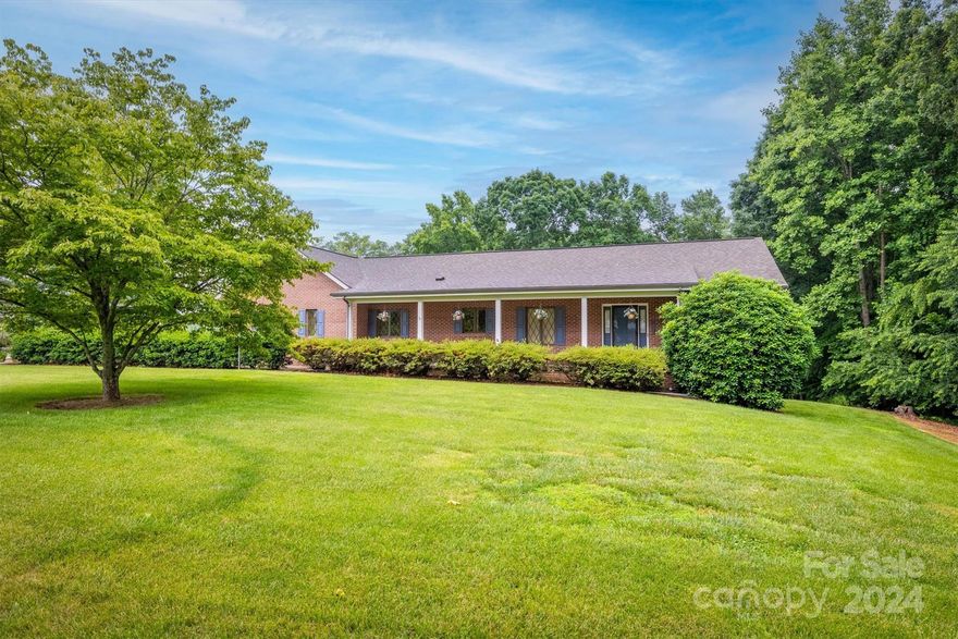 This custom built brick ranch with nearly 6 acres and tons of extras won't last long! You will love the open concept and split bedroom floor plan all on one level! Upon entry note the spacious living room w/ vaulted ceiling & double door entry to the covered trex deck. Large kitchen w/ breakfast bar, newer SS appliances, island, breakfast area, and tons of cabinets. The primary bedroom offers a huge walk-in closet & laundry room off the primary private bath. The private bath has a dual vanity & updated step-in shower. The oversized garage has a utility/storage room attached. Below the deck theres a poured patio and stand up crawl space. At the back of the property theres a detached 3rd single garage & workshop w/ another garage area. Above the workshop is a finished room that would be perfect for an office. The roof was replaced in 2017 and there a brand NEW Hvac. There is also a metal RV style carport. Definitely check out the gorgeous land behind the home & the mountain views! As-is