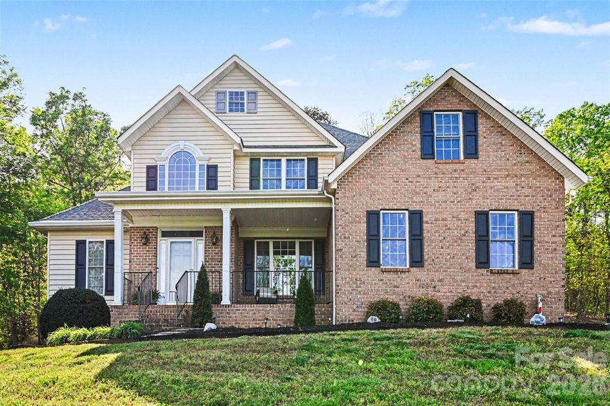 You will feel like royalty coming up the driveway to this beautiful custom brick home perched at the pinnacle of the prestigious Oakmont development. Enjoy the long-range 180 degree views of Bakers Mountain which is only 10 minutes away! When you enter you are immediately awed by the soaring ceilings and stately columns. Featuring 4 bedrooms and 3 full bathrooms, kitchen with granite counters, double ovens and a breakfast area, formal dining room as well as an office space! You'll love the vaulted ceilings and spacious open floor plan. The large primary bedroom is on the main level and features high tray ceiling, jacuzzi tub, double vanity and a large walk-in closet. The second floor features three bedrooms and another full bathroom. Relax on the front porch or back stone patio and enjoy being surrounded by nature and the outdoor scenery. You will have the best views of birds, rainbows, sunrises, sunset colors on the back side of Piney Mountain and stars every day! You're approx 15 minutes to Lenoir Rhyne Univeristy, Appalachian State University Hickory Campus, Hickory Crawdads Minor League Baseball Stadium, Downtown Hickory, Hickory Farmers Market, Approx 1 hour from Blowing Rock, Boone, & Asheville. Do not miss out on this gem!