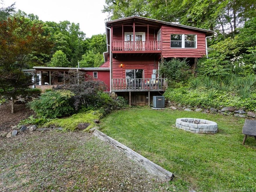 One of a kind rustic charmer!  A true private mountain retreat offering an abundance of history and character.  Home has bonus areas such as solarium and sunroom.  Conveniently located in Arden, minutes to school and shopping.