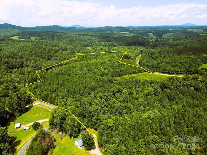 41+/- acres nestled in the shadows of the South Mountains and near South Mountains State Park. Over 500' of road frontage on Old NC 18 and over 900' on Rhoney Rd! Great for hunting, building a dream home, recreation, or growing timber. The property has an open field that is approximately 1 acre in size. The field is grown over and needs bush hogging. One of the many highlights of the property is over 800' of frontage on Jacob Fork River that winds through the north side of the property. Approximately 4.25+/- acres are in the floodplain (inclusive of the river) where the river winds through the property. County water is available. The property is in the Present Use Value Timber Program which means deferred taxes for the landowner. If buyer chooses not to re-enroll the property back into PUV, buyer will be responsible for the 3 years of rollback taxes and interest. As long as the buyer keeps a minimum of 20 acres of timber, the buyer can take advantage of this wonderful program.