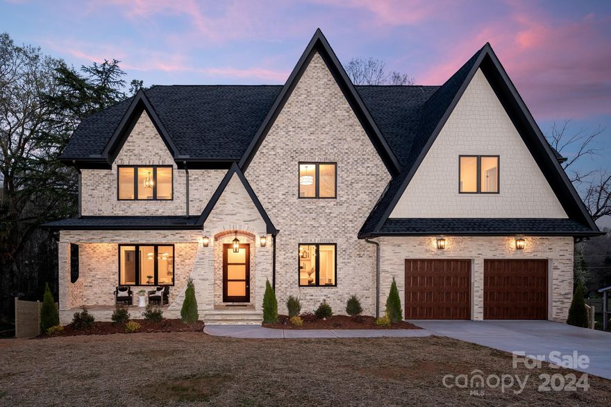 Welcome to your dream home! This custom-built 2-story + basement residence in the coveted Cotswold area offers luxury and comfort. With almost 6,000 square feet of living space, this home is an entertainer's dream and provides ample room to create cherished memories. As you enter the front door, you'll be greeted by a spacious foyer that flows seamlessly into the open-concept living area. The main floor features a stunning chef's kitchen with top-of-the-line appliances, custom cabinetry, and an oversized island perfect for hosting guests. Upstairs, you'll find a luxurious master suite with a spa-like ensuite and a walk-in closet. The second floor also features three secondary bedrooms and three full baths. But that's not all – this home also boasts a basement living area, perfect for a game room, home theater, or even a separate living space. Located in the highly desirable Cotswold area, this home is just minutes from some of Charlotte's best shopping, dining, & entertainment options.