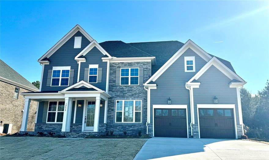 The Arlington is an award-winning open floor plan with a two-story family room that allows light to flow from room to room. At the front of the home, you will find a formal Dining Room and Flex Room. The Flex room would make a great home office and has double doors that can be closed for additional privacy. The kitchen is designed with ample storage and prep space.  The large island is a great place for guests to gather, and the flow from the Butler’s pantry into the formal Dining Space make entertaining a breeze. You will also find an informal dining area located off of the kitchen, as well as a first floor guest suite. The main suite is located on the second floor and features a large walk-in closet, and a luxurious bath.  There is also three additional bedrooms and 2 full bathrooms upstairs.