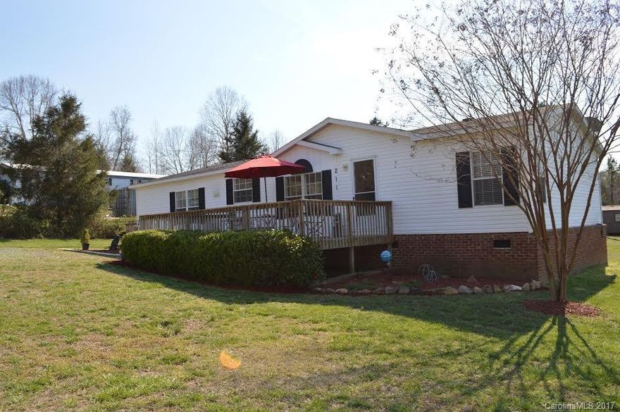 Beautiful move in ready 3 bedroom, 2 bath home with over 2.6 ac., including 2 sheds and a pole barn.  Nice and bright kitchen with a center island, plus built in that could be used as a computer area.  Laundry area located off the kitchen.  Great living room with a cozy fireplace.  Master bathroom has dual sinks, garden tub. All bedrooms have walk in closets.  2-10 Home Warranty included.