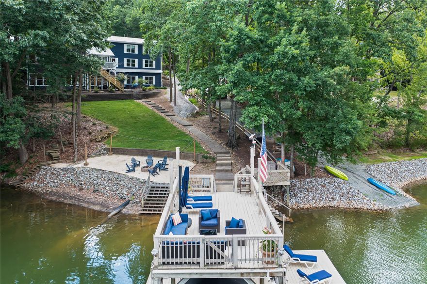 Back on the market at no fault of the seller.  Home appraised and inspected, with seller completing all repairs.  Discover the epitome of lakeside luxury living at this exquisite Lake Norman front property. Nestled on an expansive lot, this home boasts a private beach area that provides a serene retreat. The presence of a two-story dock further enhances the allure of this lakeside gem, making it a true waterfront haven. Sunlight floods the interiors, creating an inviting ambiance that seamlessly blends with the stunning natural surroundings. Remarkable kitchen and floorplan, perfect for entertaining.  This home offers a private in-law suite, perfect for accommodating guests or extended family members in style.  Situated in a secluded setting, this property offers privacy and tranquility, ensuring that every moment spent here is a cherished escape from the ordinary. Experience the essence of Lake Norman living in this exceptional home.  No HOA. One of the best $/sqft on LKN.