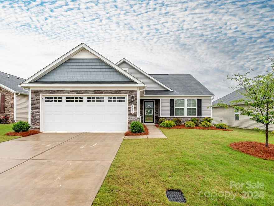 ***Showings start Friday June 7th!*** Move-in ready one-level living in desirable Hunton Forest!  When they purchased this home, the sellers selected an upgrade package which includes gorgeous kitchen & bath cabinets, gleaming quartz countertops in the kitchen and handsome wide plank wood flooring in the main living areas.  Additional elevated features include custom plantation blinds throughout, ceiling fans, stainless appliances, an oversized laundry room and a spacious garage.  The primary bedroom has a HUGE walk-in closet, plus an ensuite bath with dual sinks and a tiled walk-in shower.  Hunton Forest is conveniently situated near I-85 and plenty of shopping & dining choices, and has a great community pool and sidewalk-lined streets throughout.  **HOA dues include lawn care for this home...wow!